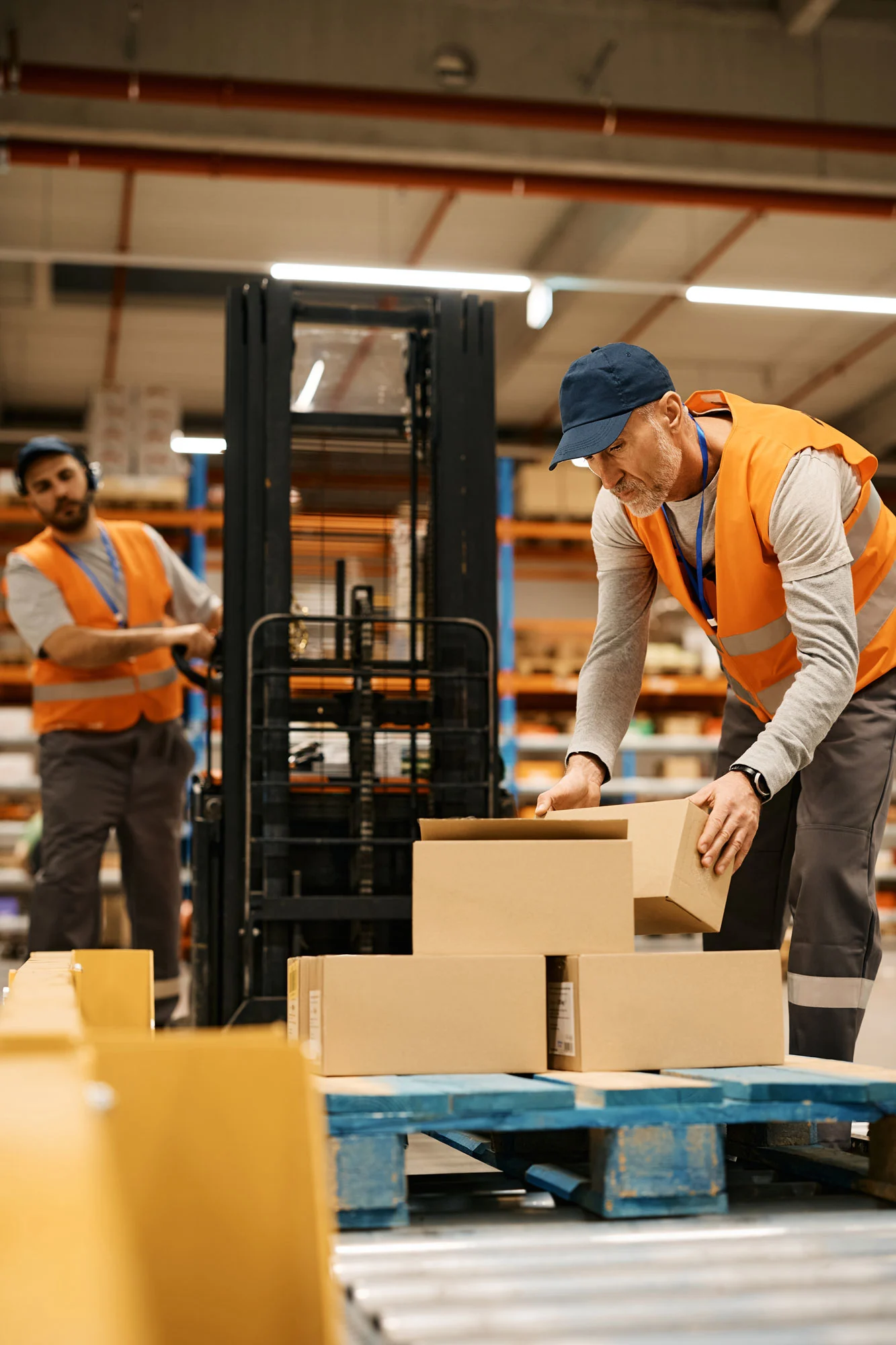 Warehouse workers organizing packages for dispatch